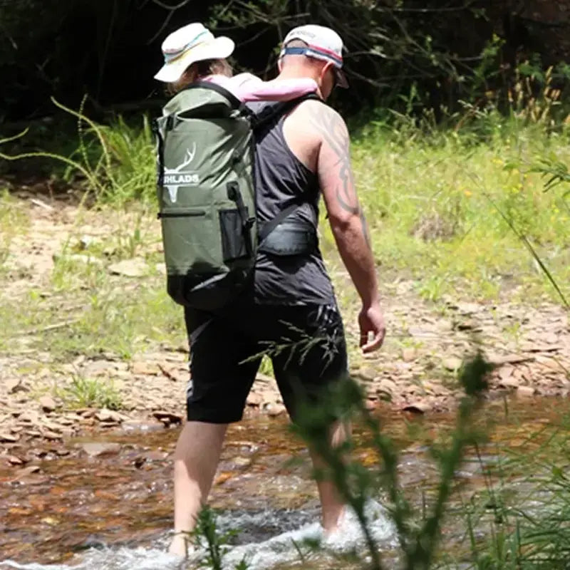 Two hikers on a bush trail, one carrying the Bushlads 35L backpack