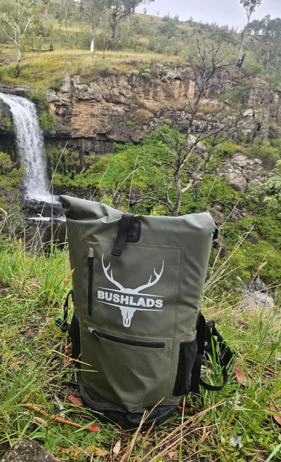 Bushlads pack by a waterfall
