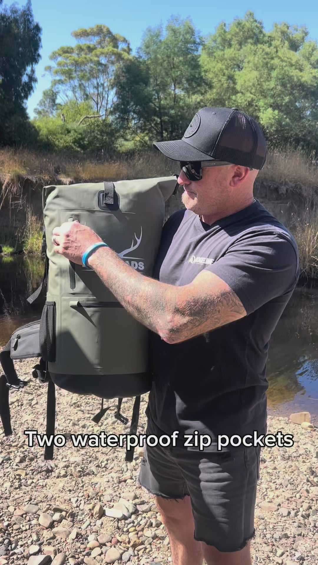 Man carrying the Bushlads 35L backpack by the haul handle